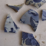 Ceramics Blue on White that we found while clearing the site around the Portuguese houses. Luanze, Zimbabwe. Author and Copyright Chris Dunbar